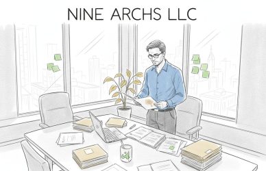 Professional sorting documents in sunlit office