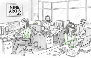 Office team multitasking at desks in corner office