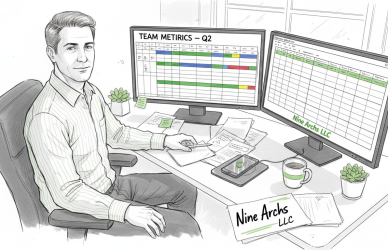 Manager reviewing remote team dashboard at home